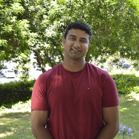 Photo of a man wearing a red shirt.
